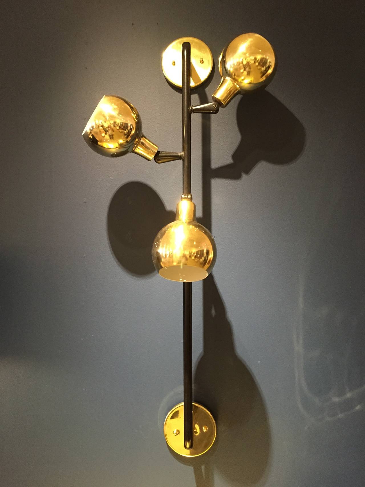 Great three globes in brass wall light.
