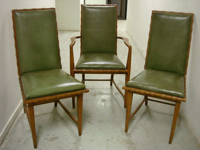 Two host and hostess armchairs and four armless chairs in original green leather. Wood backs and notched edges. Simply wonderfully.

Note: Dimensions for the two armchairs are as follows:
24