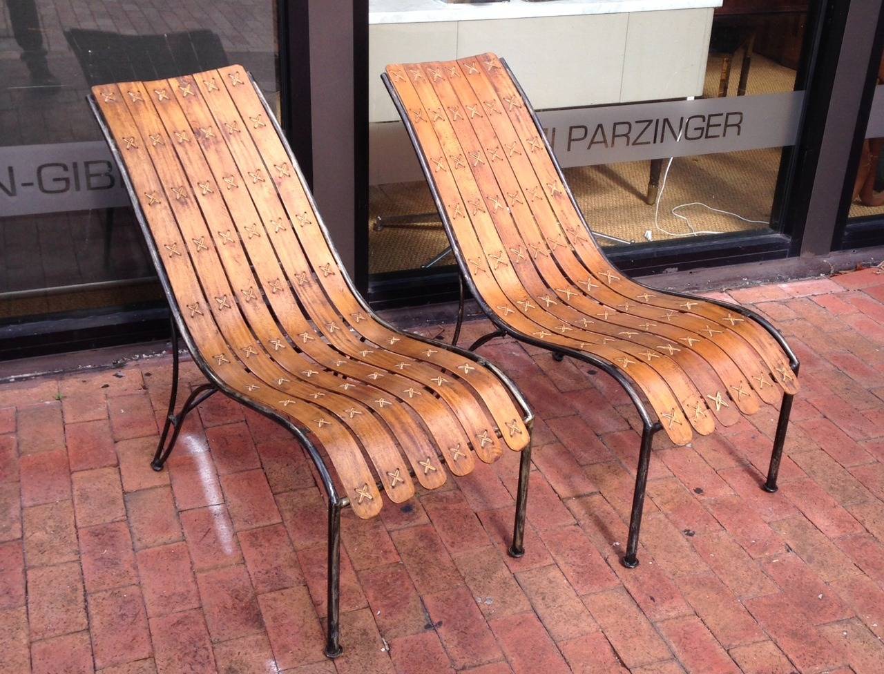 In the manner of Hans Brattrud lounge chairs - these are bentwood on metal frame.
    