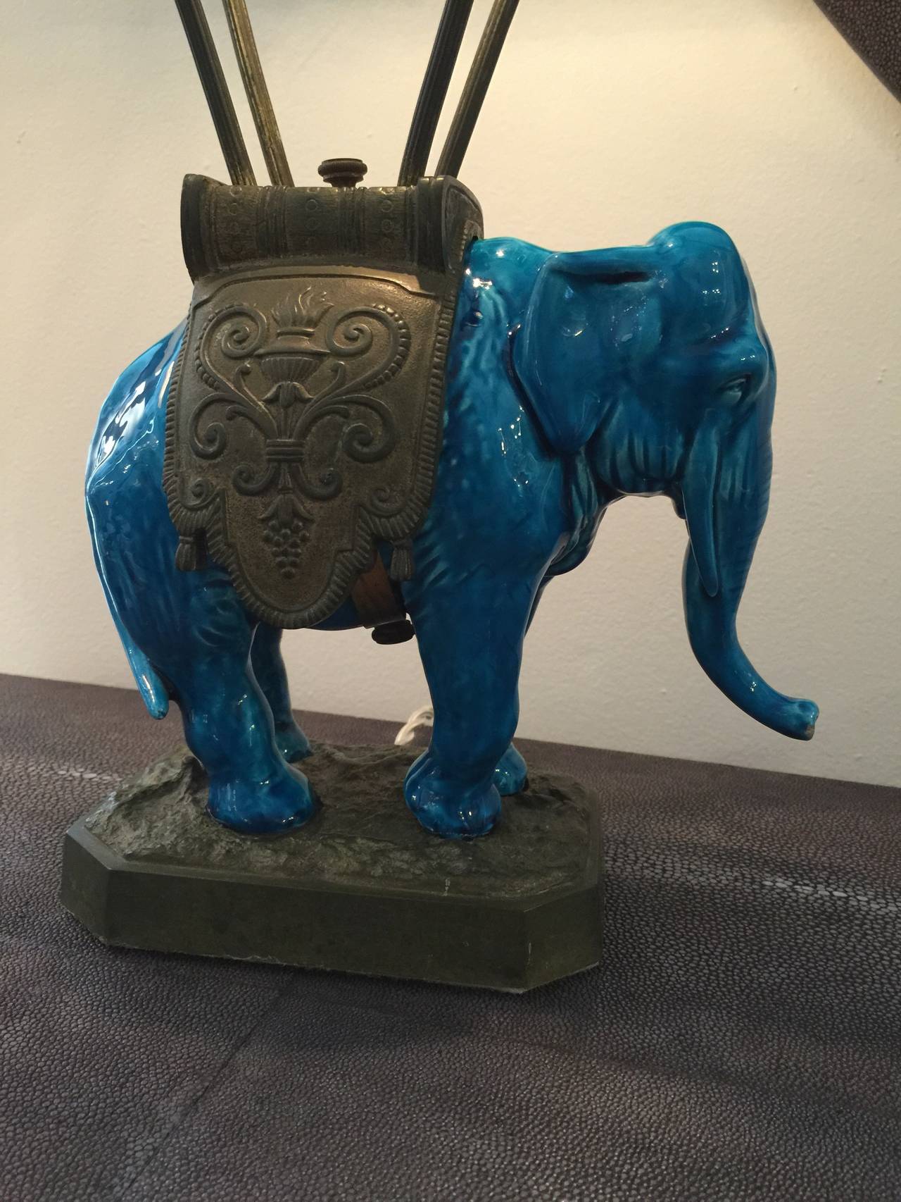 So many wonderful details.....a crystal beaded canopy with brass accents for the rich turquoise ceramic elephant lamp. Beyond adorable! Newly rewired.