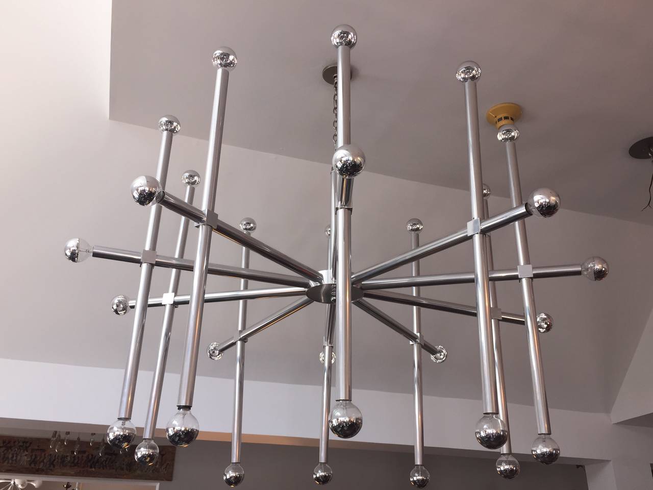 This is an extremely rare chandelier by John Vesey - very impactful to see in person. Large scale fixture for large scale projects or commercial use. 
 Beautiful arms with 25-40 watt mercury tipped light bulbs (best to be used on a dimmer). This