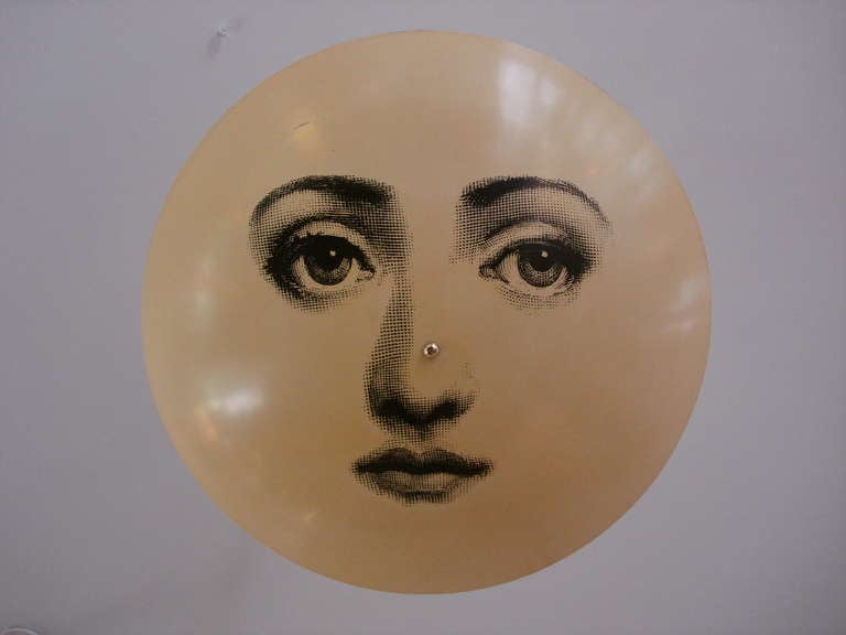 Featuring the face of opera singer Lina Cavalieri.  Fornasetti created more than 350 variations in design on such everyday objects as plates and table lamps inspired by her face.