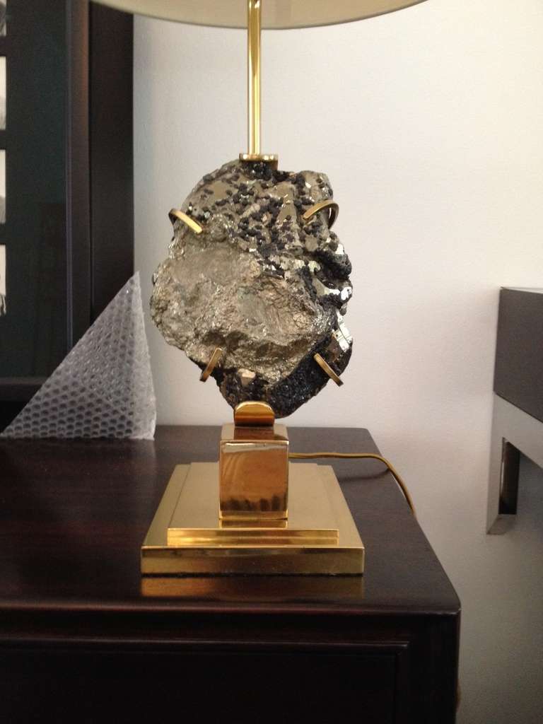 A mounted giant Pyrite specimen lamp on a brass base by Willy Daro, France, circa 1970s.  SHADE NOT included.
 