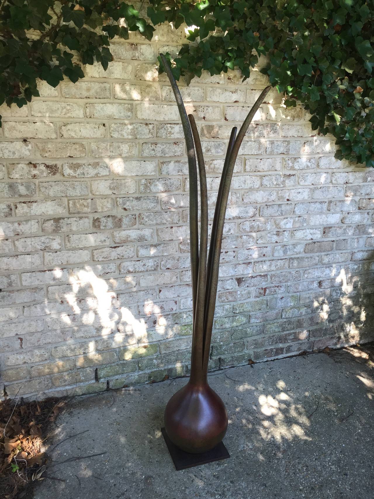 This nearly six foot tall solid bronze sculpture of a scallion has incredible weight and patina. Whimsical and important. Signed and dated to base.