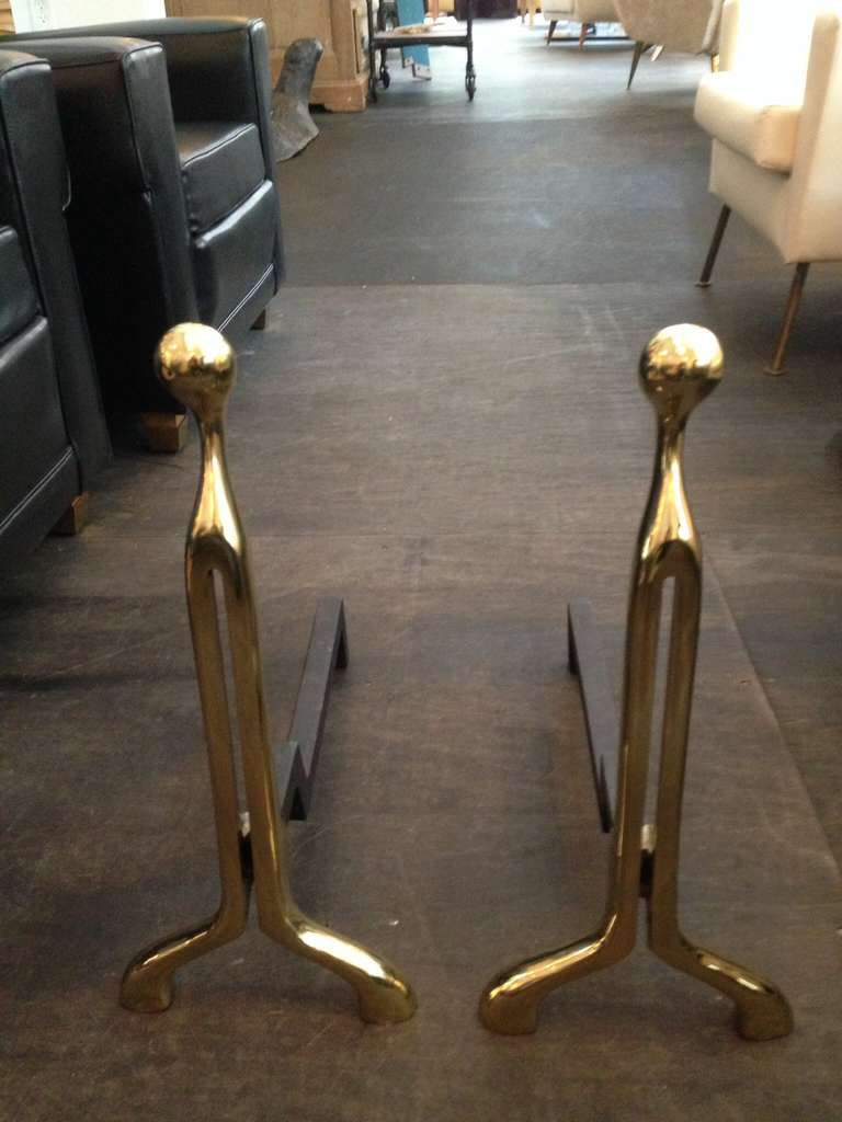 Extremely sculptural pair of heavy vintage brass andirons by Virginia Metalcrafters.