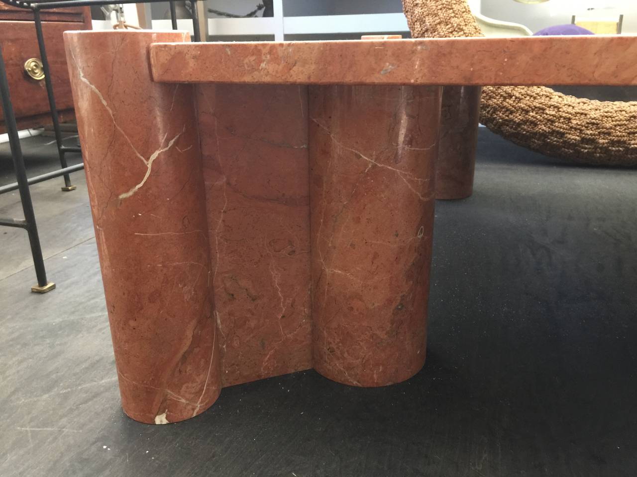 Oversized and heavy statement cocktail table crafted in Rosso marble.