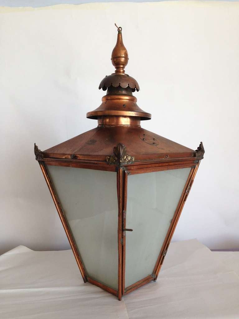 Exceptional antique large hanging light with four lights inside frosted panels and copper structure. Recommend 40 watt Edison bulbs.