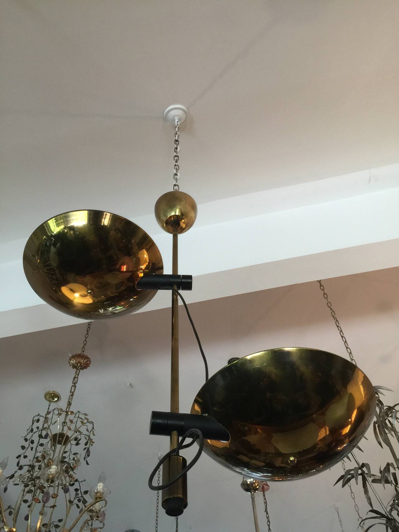 Rarely available Italian double bowl brass uplight fixure. The bowl fixtures can be adjusted vertically and horizontally. Each bowl is uplit with holds a 250W halogen bulb. Original canopy.  Dimensions listed below are approximate - exact dimensions