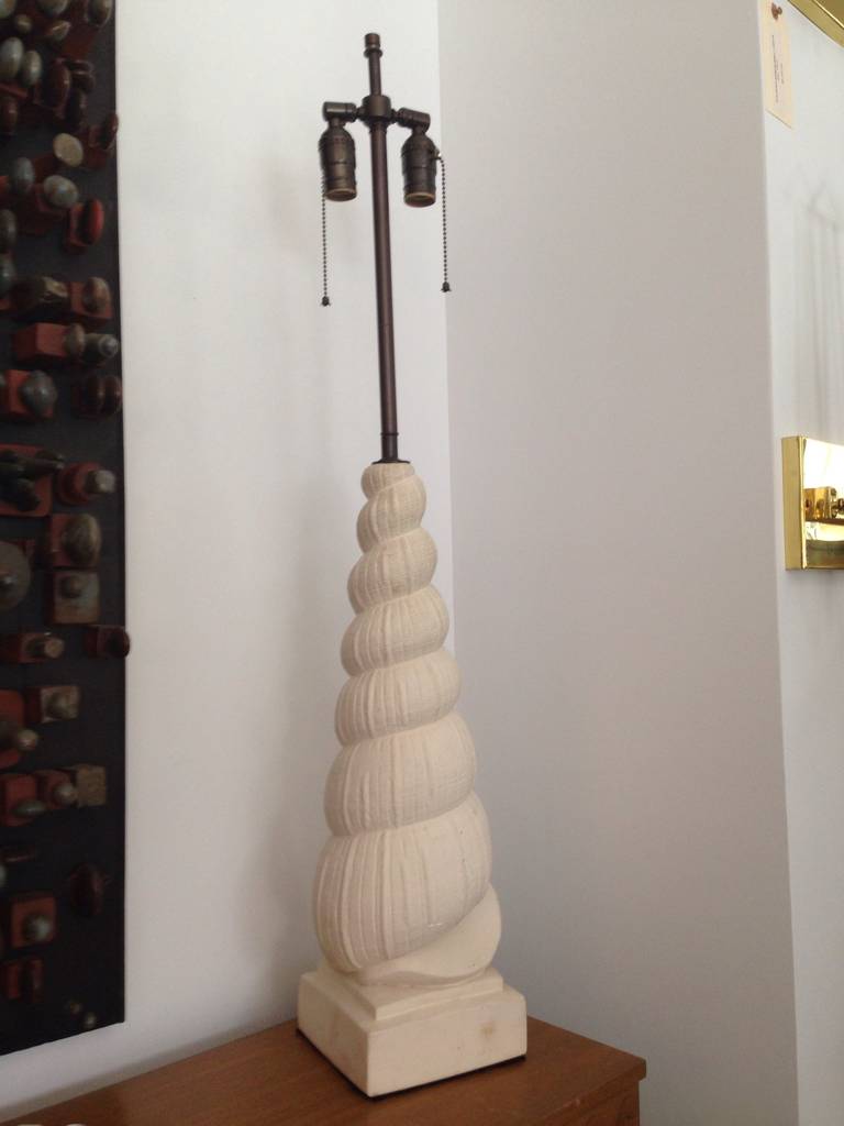 Newly rewired this original plaster lamp in nautilus form is sculptural and tall.