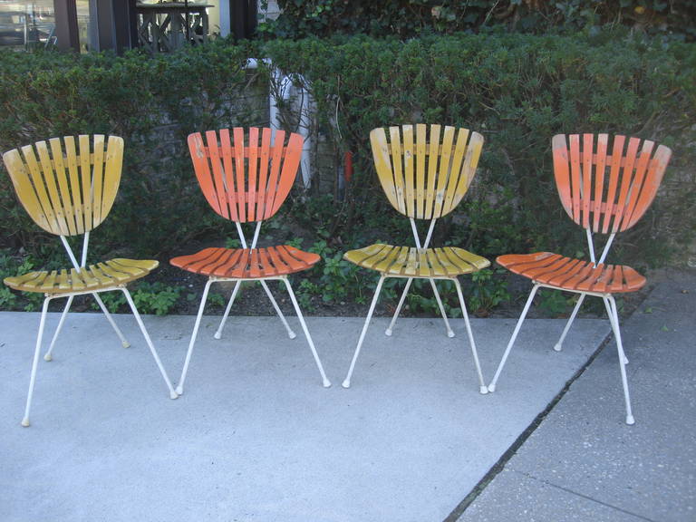 In original distressed orange and yellow painted wood, these chairs are perfect for interior or exterior décor.  ALL original.  Sold as PAIRS - yellow or orange.

Seat height is 17.5