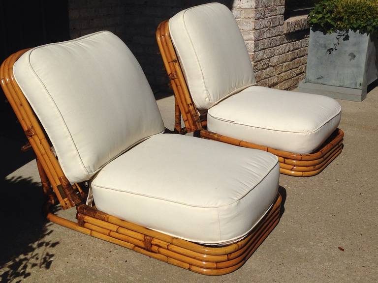 These reclining chairs made entirely of Malacca Rattan and are key elements of Crespi's visionary rising sun collection created in 1974. Each is signed to brass plaque, original seat cushions in great condition. May need re-upholstery or