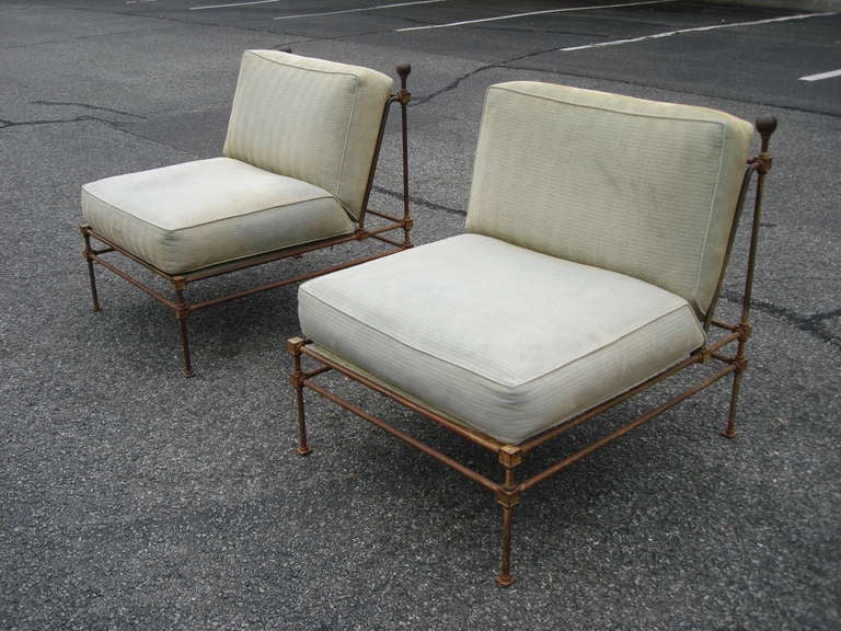 Extremely well crafted in heavy iron with distinguished ball finials.  Original steel springs.