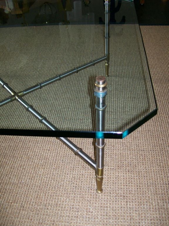 Beautiful detailed base in brushed steel and brass faux bamboo design.  Custom glass table top.  Exception piece!1