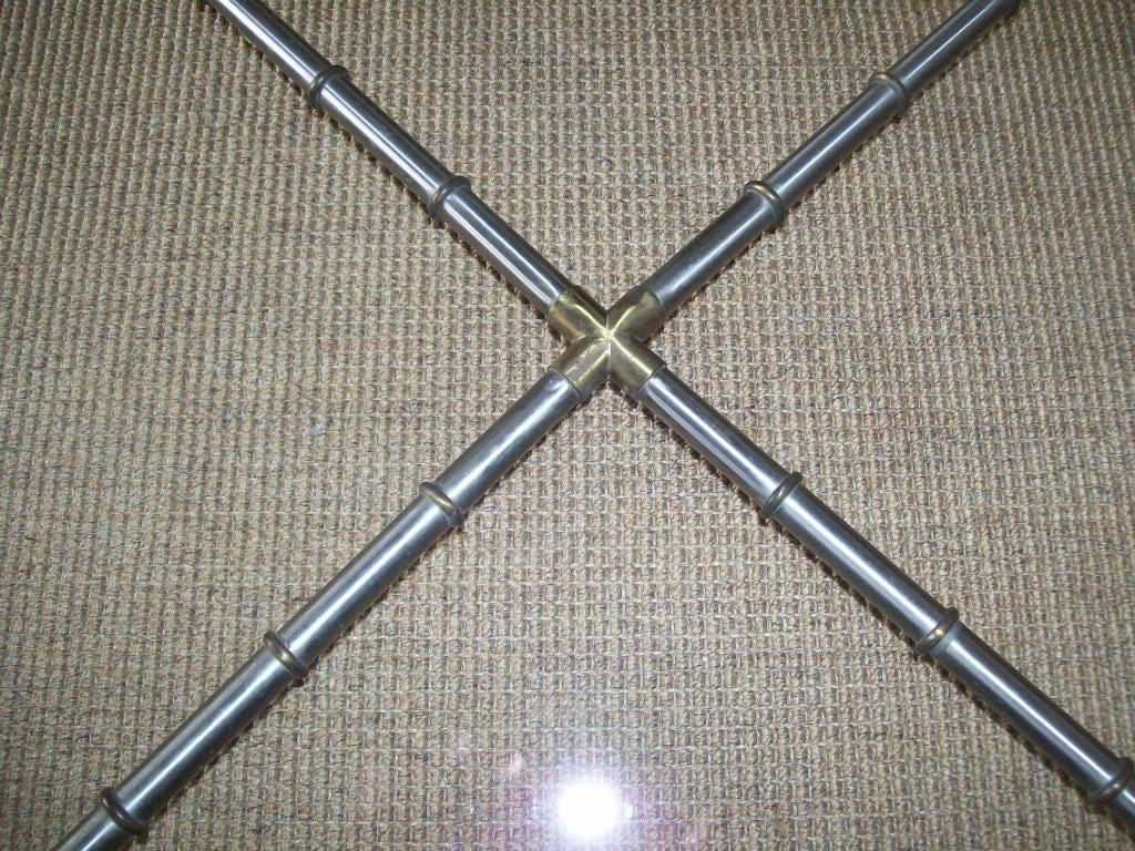 American An X Shape Glass Cocktail Table with Metal Bamboo Detail