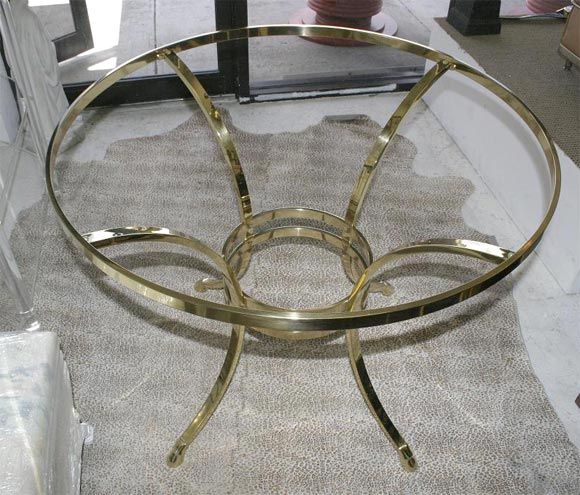 Rams feet details in the legs of this polished brass large round gueridon table.  Perfect for a foyer or library table.