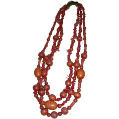 A Retro Coral and Bone Three-Strand Necklace