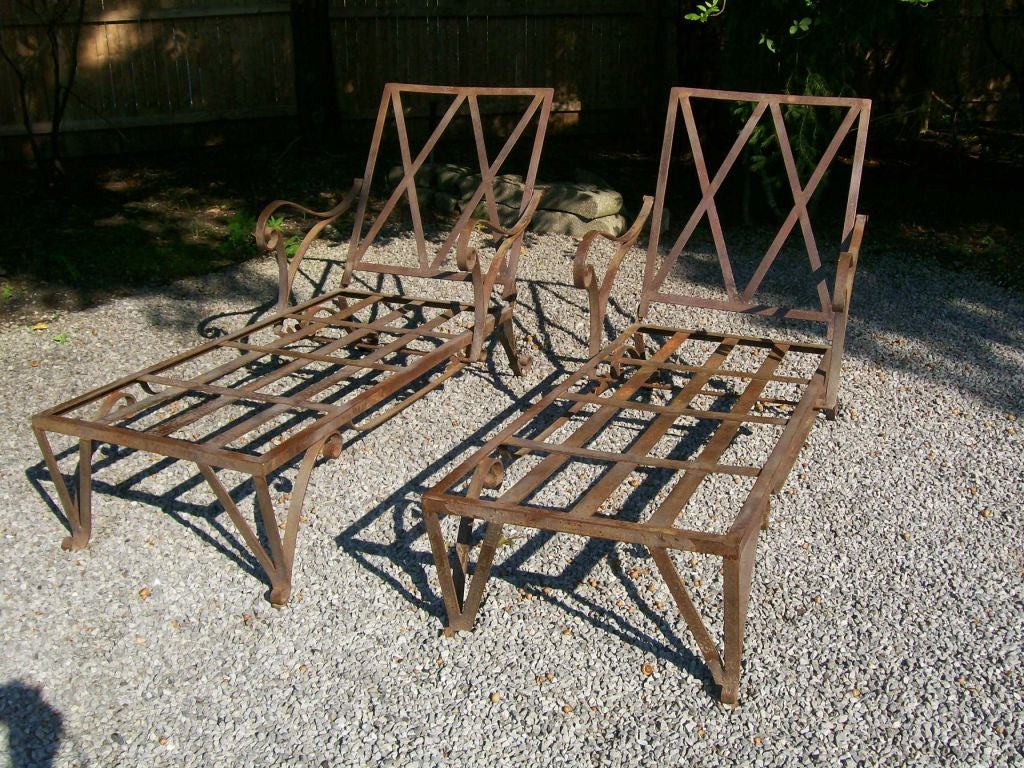Lattice backrest, scrolled feet and flourishes in iron throughout.  These a part of a SET which are being sold separately (two armchairs and two side tables).