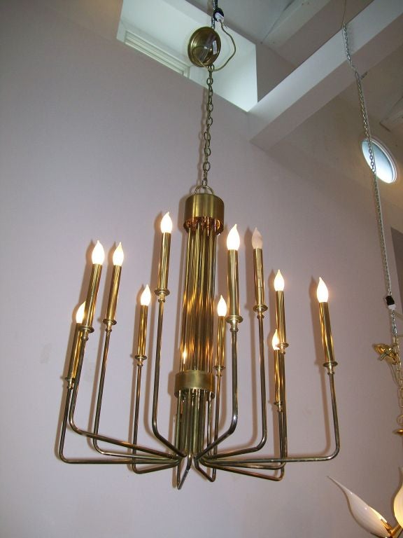 A wonderfully classic twelve-light chandelier in descending rods.