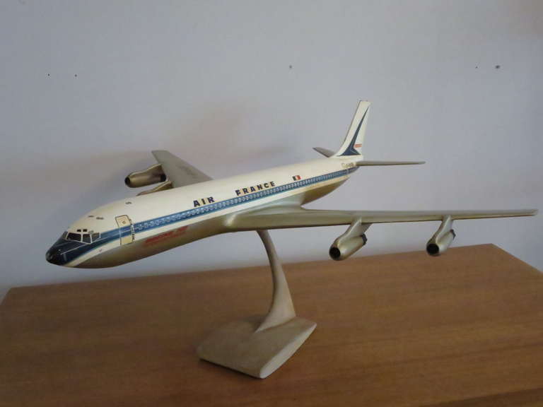 Desk display model  of Intercontinental Boeing 707 on metal stand in its original vintage condition.