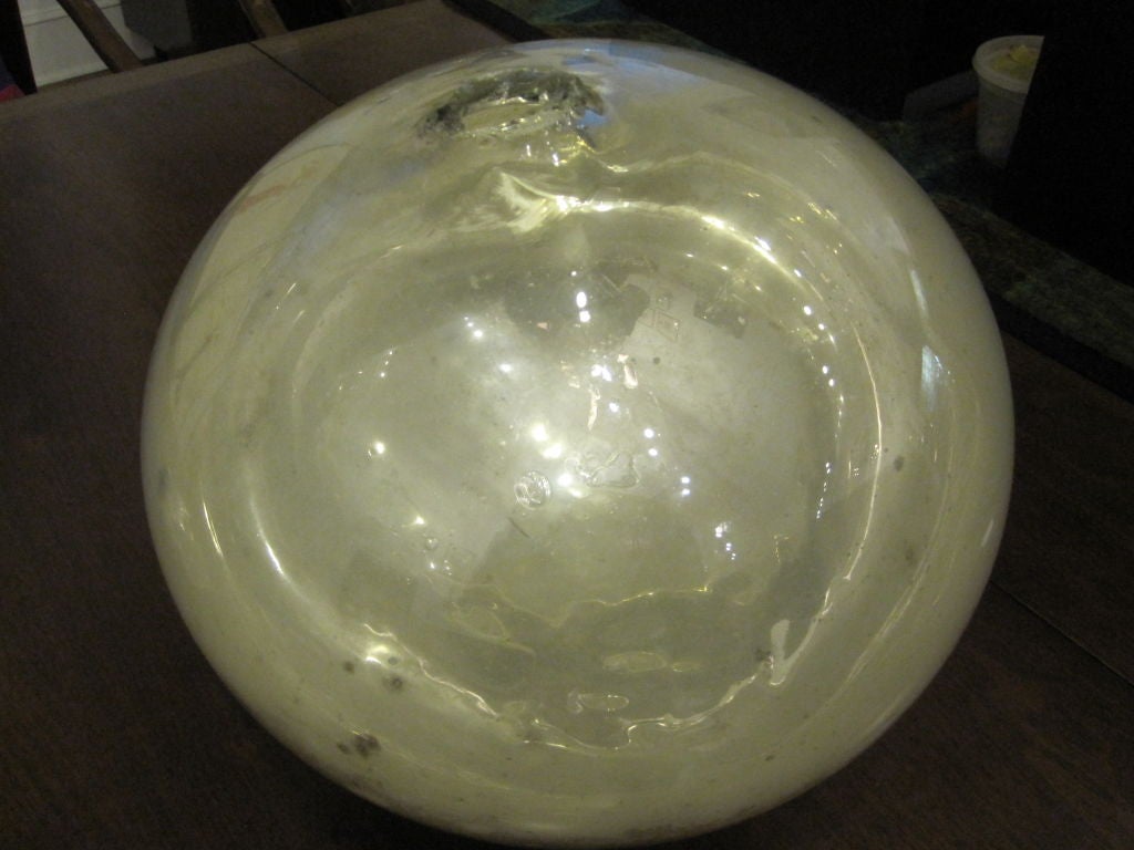 Old hand blown mercury glass ball, 
amazing silver color.
