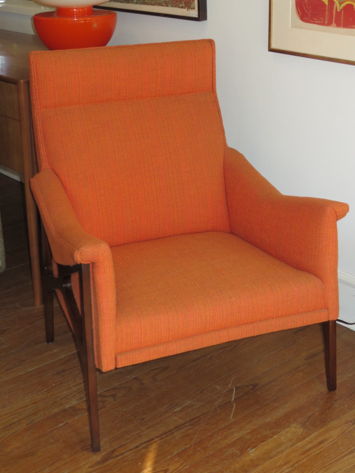 1960s armchair in the style of Paul McCobb. The  chair's design is sculptural and appealing from every angle. Chair is very solid yet appears to float, characteristic of Mid-Century design.