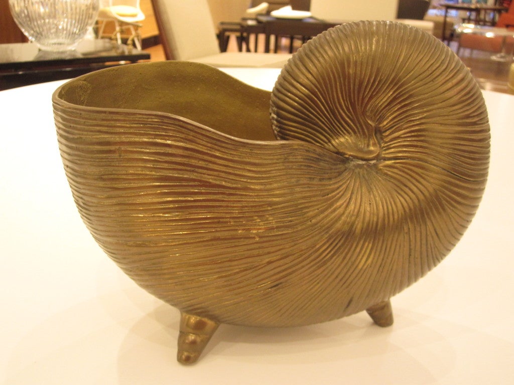 Brass nautilus shaped bowl, with very nice patina, can be used as a  bowl, planter or decorative object.