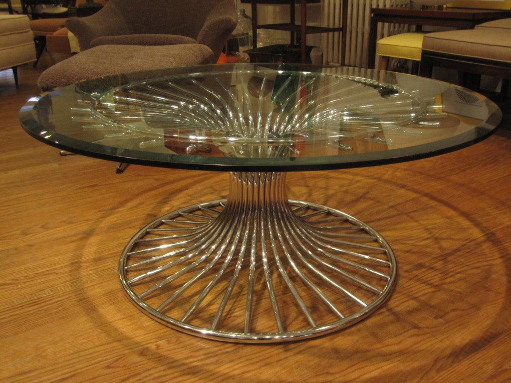 Sculptural chrome coffee table in the style of Warren Platner.  Beveled glass top is included.