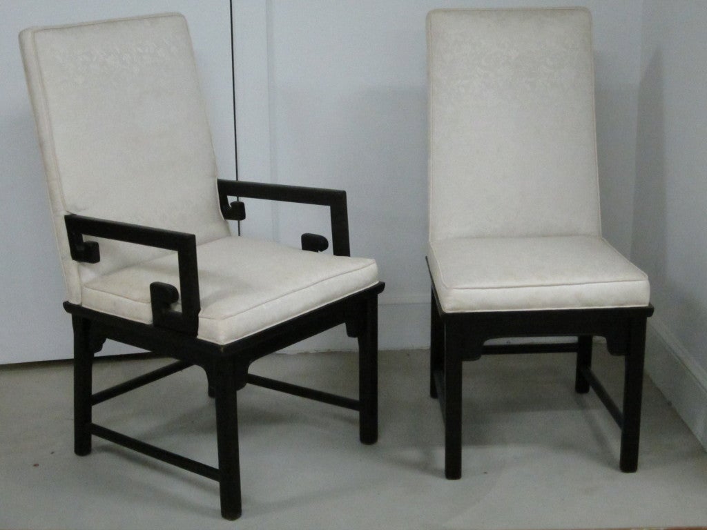 Set of six Asian inspired dining chairs, two with arms and four side, in the manner of James Mont.  The chairs have high backs and are very comfortable.