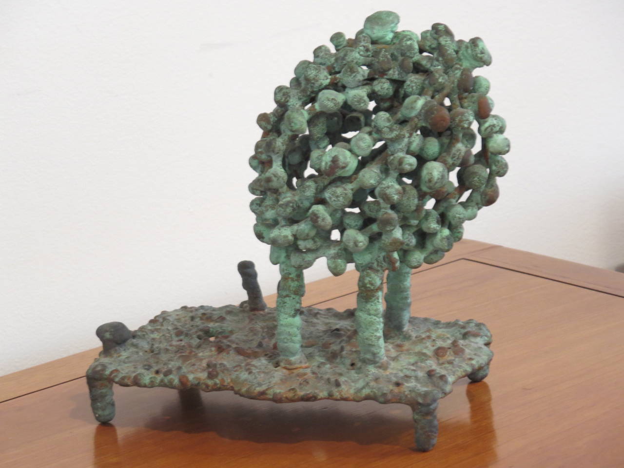Klaus Ihlenfeld, was a studio assistant to Harry Bertoia, greatly influencing his assistant. Ihlenfeld worked in patinated bronze and produced a series of abstract plant motif sculptures. This bronze sculpture is from the 1970s and was purchased