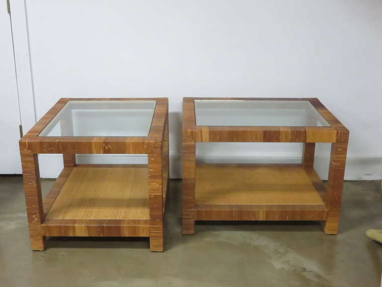 Pair of rattan side tables in the style of Billy Baldwin.