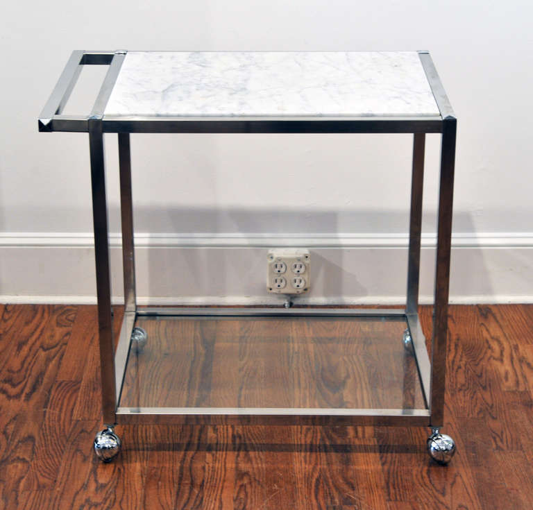 1970's crome and marble serving / bar cart in the style of Ward Bennett.   Can be used for serving, storage or food prep.