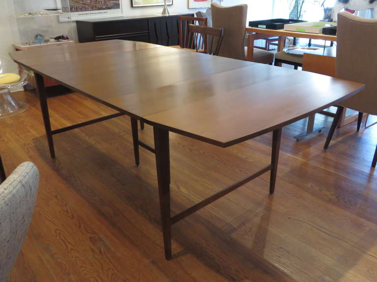 Paul McCobb drop leaf dining table with three leaves - very versatile for larger or small spaces.  The table measures 86
