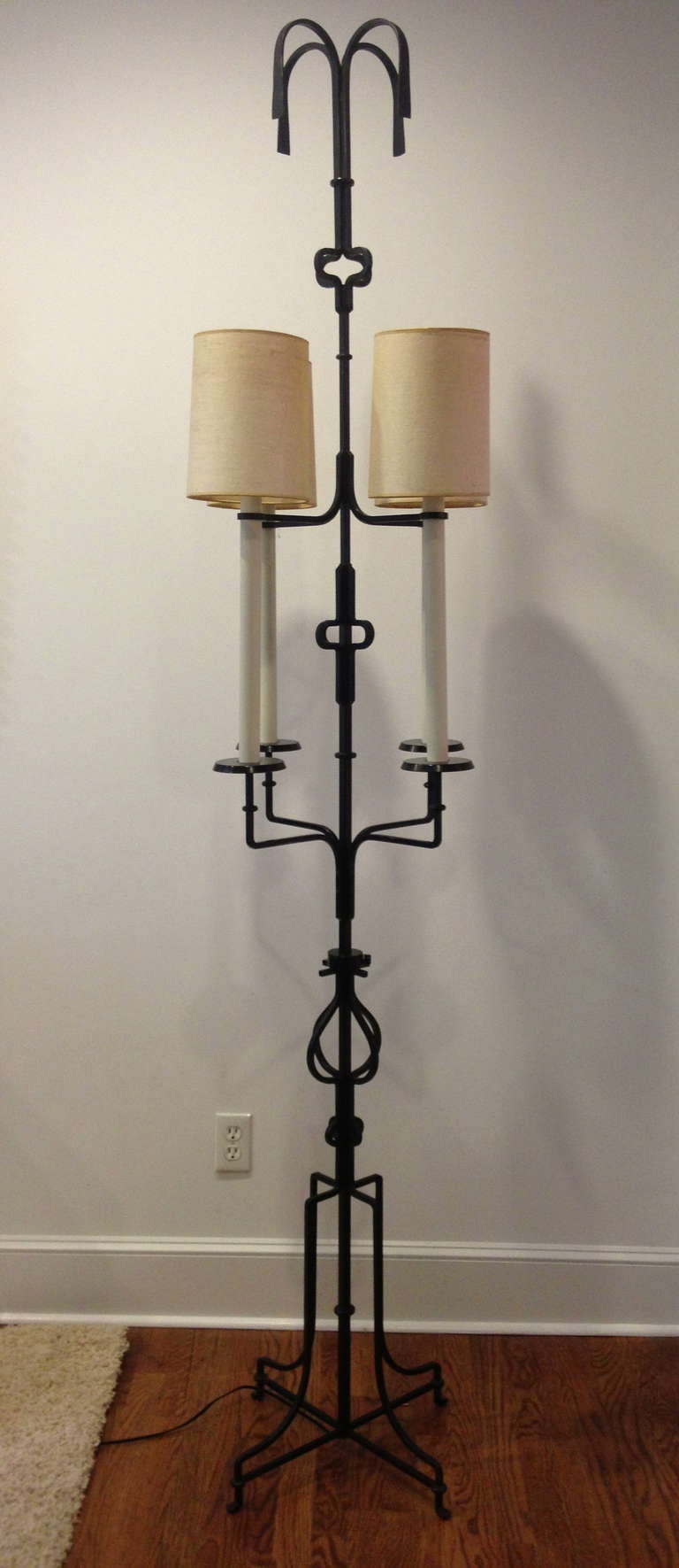 Exceptional four-light, iron floor lamp designed by Tommi Parzinger for Parzinger Originals. Height is 7 feet 5 inches.