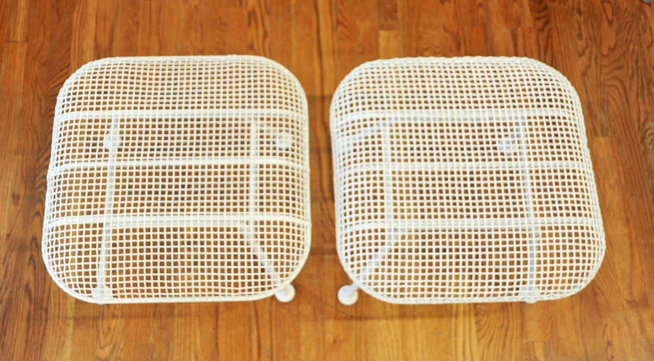 Pair of 1950's iron mesh ottomans by Russell Woodard.  Can be used indoors or outdoors.  Great for extra seating.