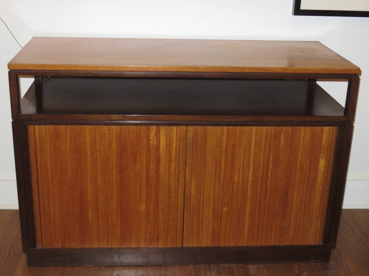 Very functional credenza could be used as a bar.  Behind tambour doors is a very useful configuration for storage and serving.