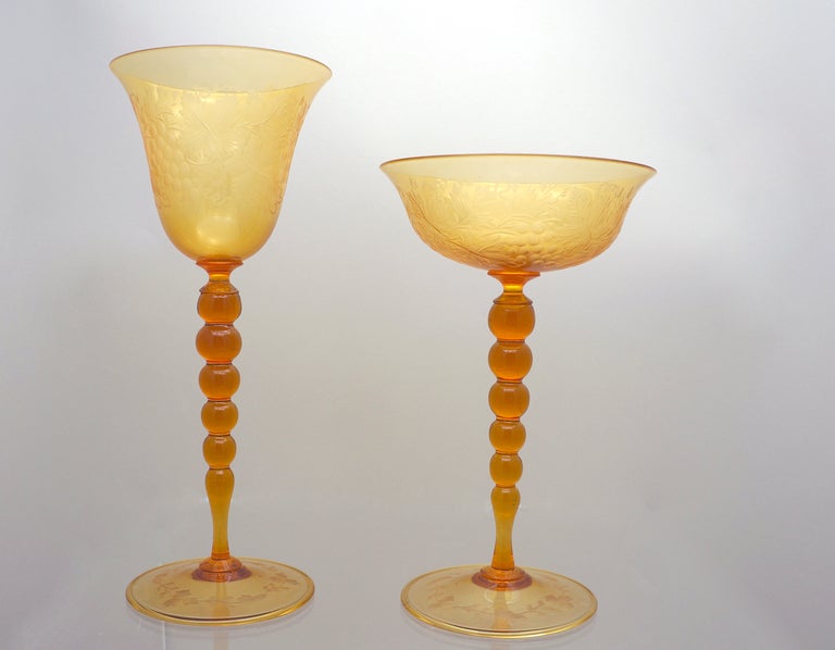 This elegant, handblown Venetian set of 16 amber goblets are beautifully engraved with grapes and leaves in the Classic 