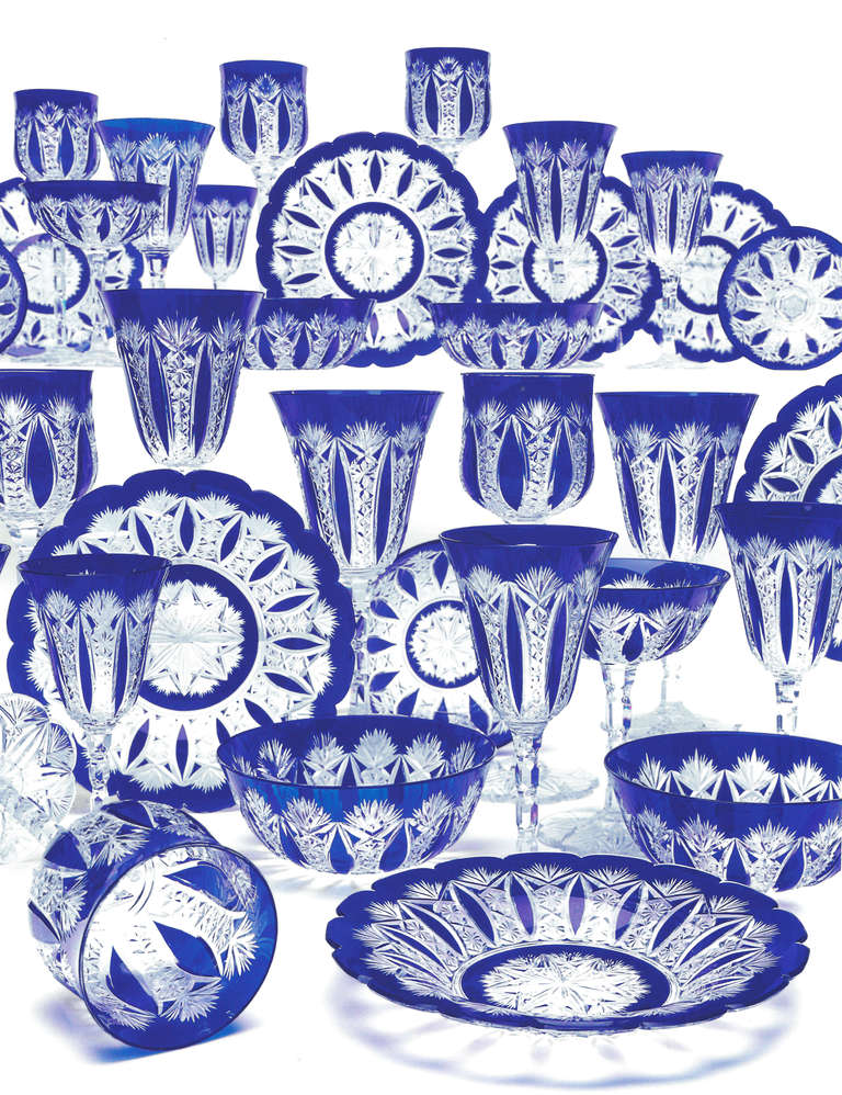 This is an incredible Baccarat cobalt cut to clear complete service for 12. All handblown crystal overlaid in cobalt blue and cut in the most complex and masterful Conde pattern, first introduced in 1908 with amazing intricately cut and notched
