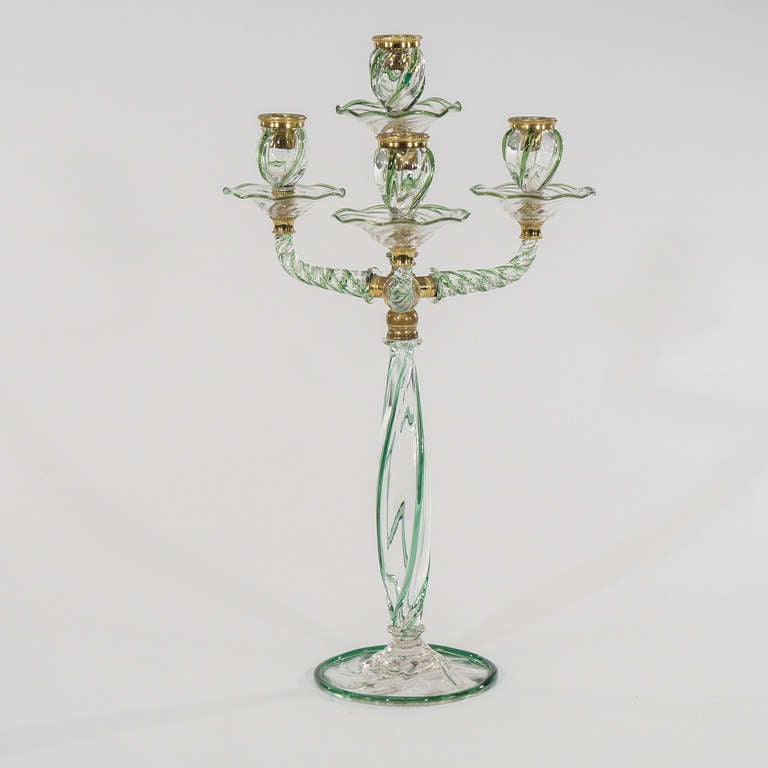 This is a very unusual and rare set of three Art Nouveau hand blown crystal candlesticks which include a 3-arm, 4-light centerpiece/candleabra, and a pair of matching single light candlesticks. These can be used all together on a table or in any