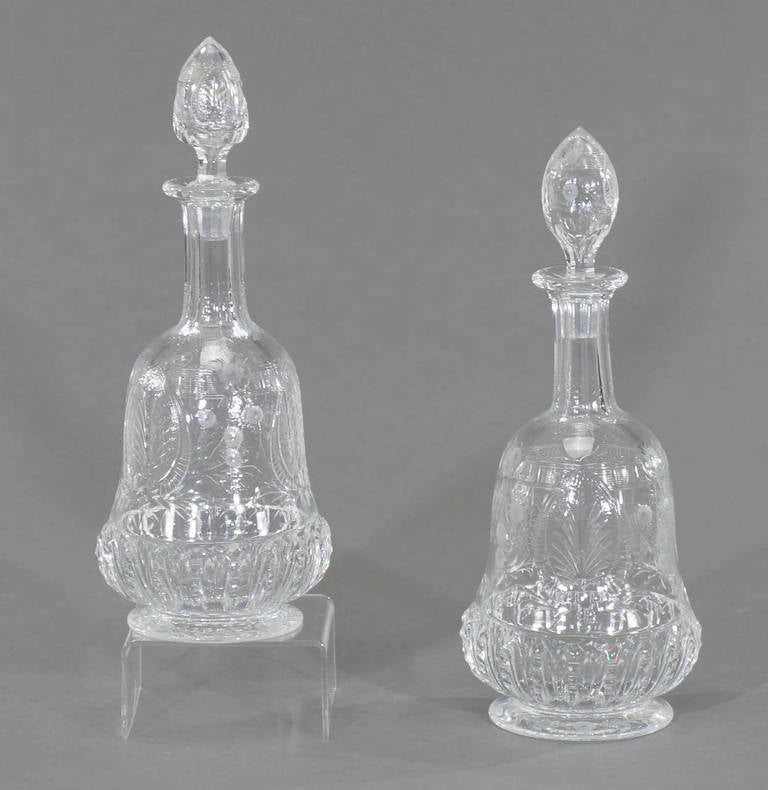  This is an extraordinary pair of hand blown decanters with all-over wheel cut decoration. Decorated with heavy 