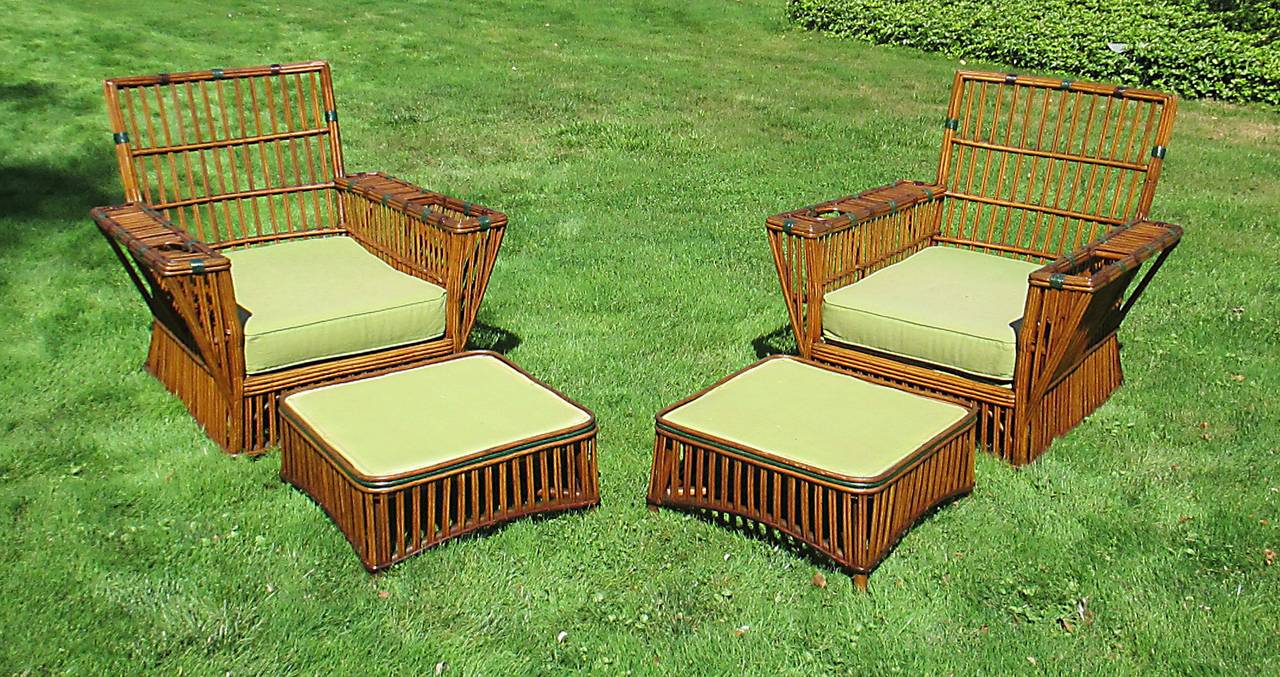 Large scale Stick Wicker armchairs & ottomans in honey-toned natural stained finish with green & eggplant trim colors.  Chairs feature large magazine holders in left arms, & recessed beverage holders in right arms.  Classic Stick Wicker squared back