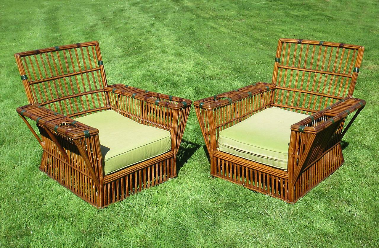 Woven Matching Pair of Stick Wicker Armchairs and Ottomans For Sale