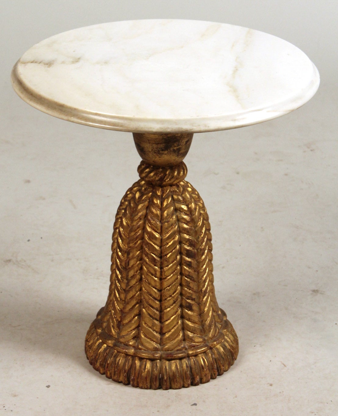 Neoclassical style Italian giltwood and marble side table. Table base in classical tassel style with beautifully veined matching marble top.