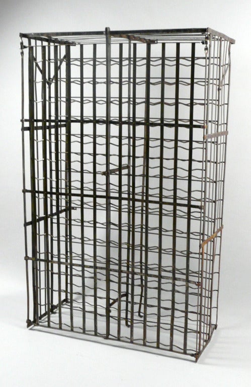 Antique French wine cage or wine locker featuring fitted slots for wine bottle storage and a pair of hinged doors with locking clasp for securing contents.

Keywords:  wine storage locker, steel wine cage, Rigidex