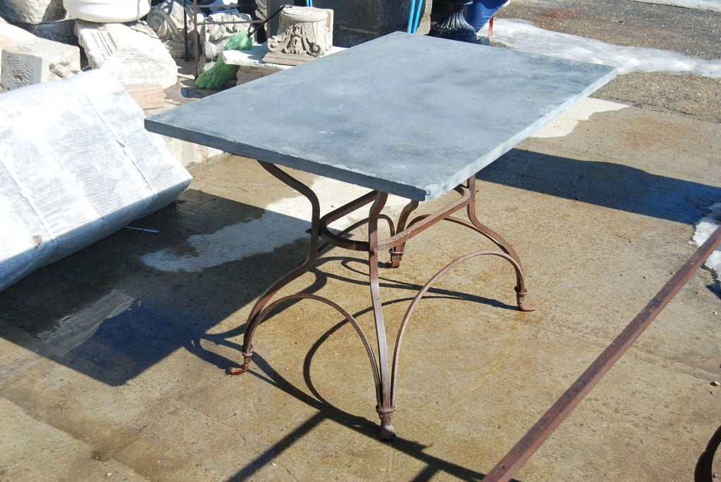 Indoor or outdoor metal base table with slate top.  Base and top can be sold separately.  $1200 for base and $700 for stone top.  Ask us about fabricating other tops.<br />
<br />
Keywords:  desk and writing table, industrial and work table, farm