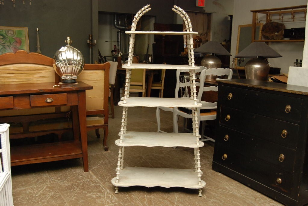 Wonderfully charming etagere made with thread spool as support posts.<br />
<br />
keywords:  Shelving unit