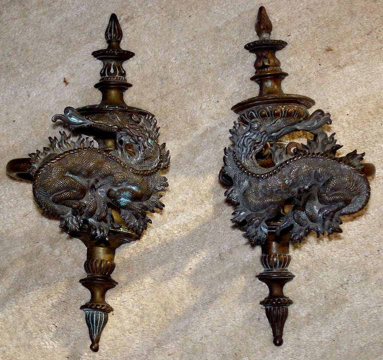 A substantial pair of elaborate curtain tie back holders (they lack the small brackets to hold them to the wall) made by or for the French Cabinet Maker
L.Dromard of Paris. These undoubtedly date from the late 19th/early 20th century

They retain