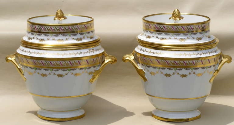 Pair of gilded and delicately painted three piece English porcelain fruit coolers or ice cream pails made in the 2nd half of the 19th century. There is no manufacturer's mark. The colors are green, grey and puce.