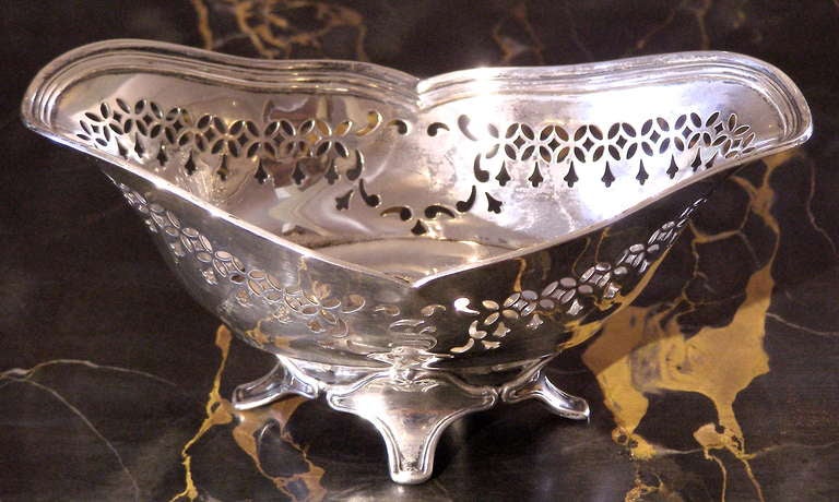 A nice little decorative solid Sterling silver dish with pierced decoration on the side. There is one engraved initial 