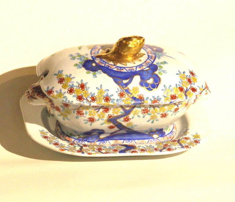 A good example of Spode's New Stone ( impressed mark) china with  pattern number 2117 written in gold on the underside of the under plate and tureen. The colors are both under and over the glaze with scattered gold highlights. The handles are