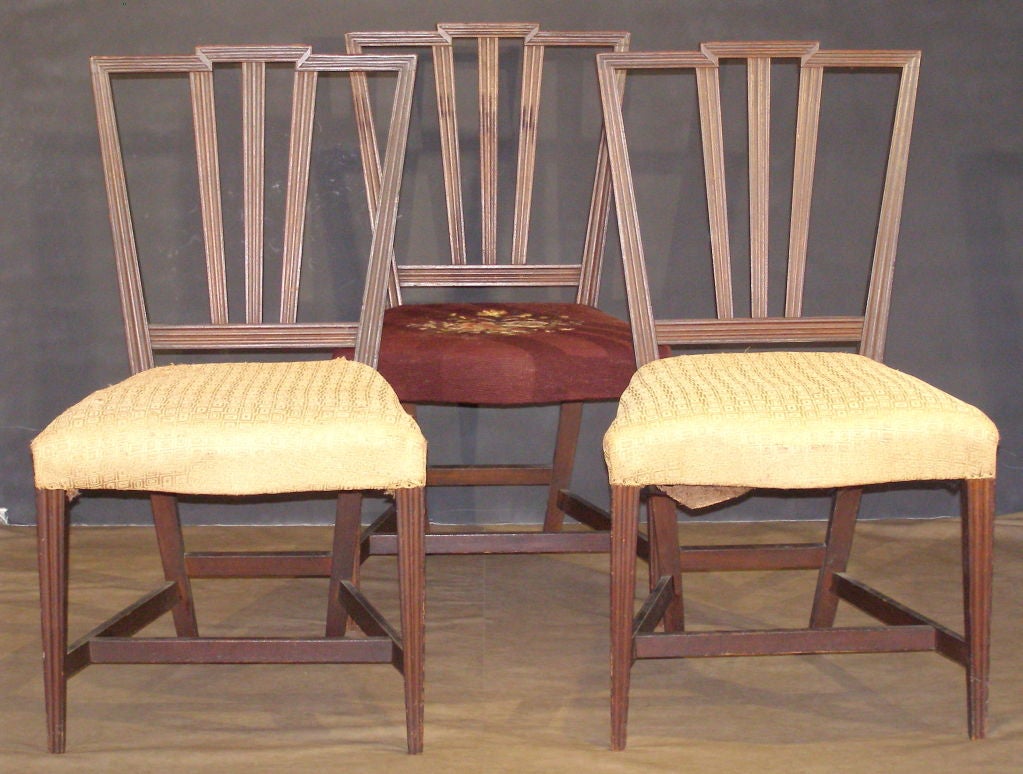 A unique design (in my experience ) of keystone form back set of three side chairs that almost convey an Art Deco feel but are late 18th century. These are purported to be from the Pittman-Dyer Family of Providence, Rhode Island. There are